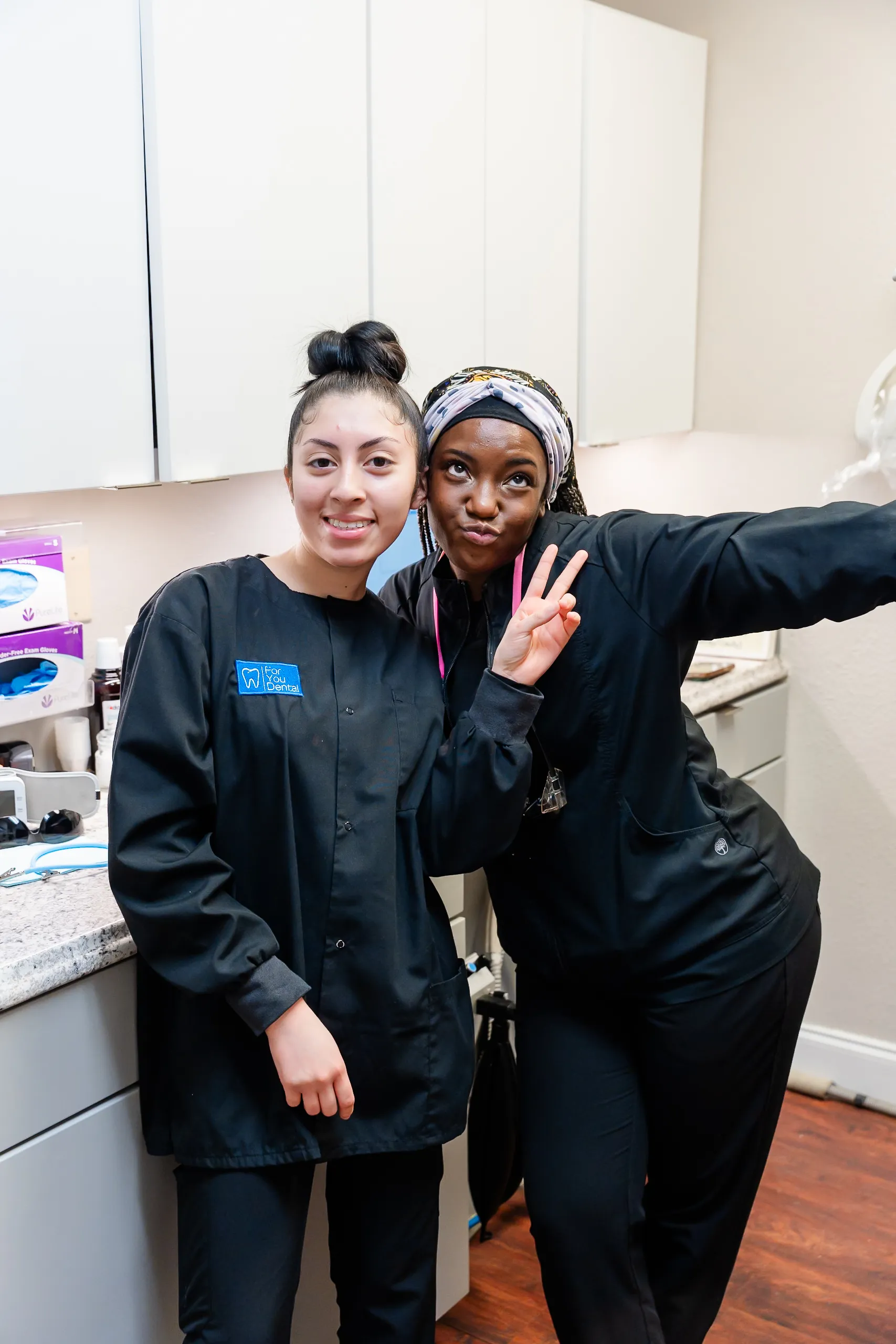 Dental team smiling at For You Dental in Dallas, TX