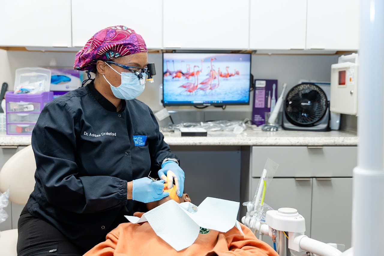 Dr. Drakeford performing a dental bonding procedure in Dallas, TX