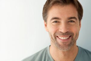 Man smiling after dental bonding with For You Dental in Dallas, TX