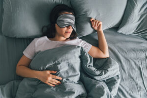 Woman sleeping with night guard from For You Dental in Carrollton, TX